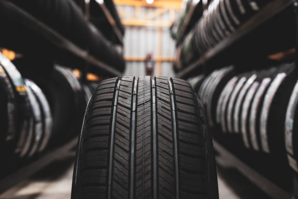 Automotive tires stacked on a rack